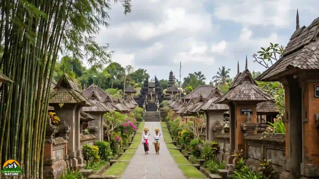 Ultimate Bali Travel Guide 7 Two women in traditional dress carrying offerings down the lined street of Penglipuran Village, Bangli, Bali